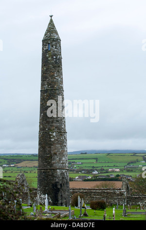 Ardmore historical round tower on the south coast of Ireland is a monastic tower built in the 12th Century in County Waterford Stock Photo