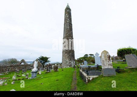 Ardmore historical round tower on the south coast of Ireland is a monastic tower built in the 12th Century in County Waterford Stock Photo