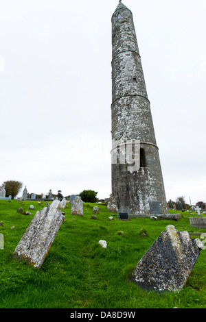 Ardmore historical round tower on the south coast of Ireland is a monastic tower built in the 12th Century in County Waterford Stock Photo