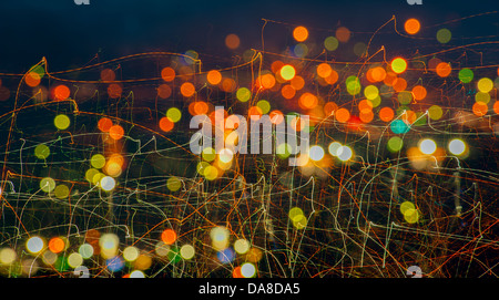 color image of blurred lights at night creating a texture and design color which can be used for background and creative space. Stock Photo