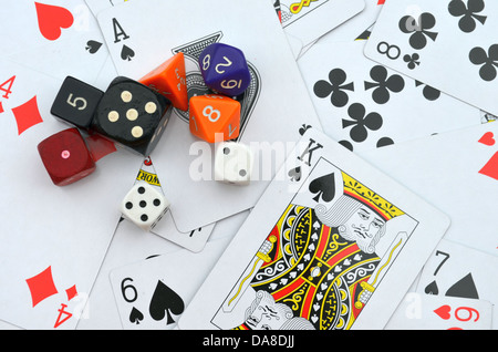 Various dices on poker card background Stock Photo