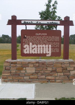 DUPUYER Dupuyer, a colorful frontier cattle town and 1880s stop on the Fort Shaw-Fort MacLeod Trail, is the oldest town between Fort Benton and the Rocky Mountains. Joe Kipp and Charlie Thomas, whiskey traders, settled here to raise cattle in 1874 and sold their holdings to Jimmy Grant in 1877. Jimmy was killed by an Indian and is buried east of the highway. Stock Photo