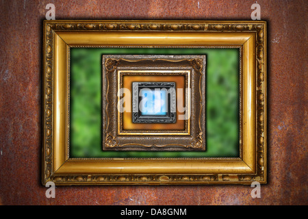 ancient carved wooden frames on industrial rusty wall backdrop - different out of focus backgrounds - summmer, fall and sky Stock Photo