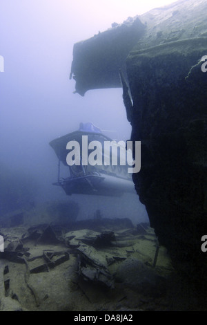 Submarine exploring a shipwreck Stock Photo