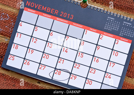 Monthly calendar hung on a wall with Thursday 28th November circled - Thanksgiving in the USA, 2013 Stock Photo