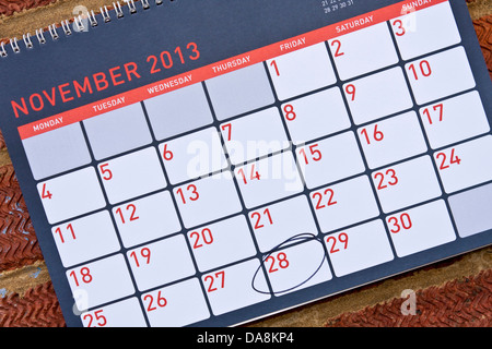 Monthly calendar hung on a wall with Thursday 28th November circled - Thanksgiving in the USA, 2013 Stock Photo