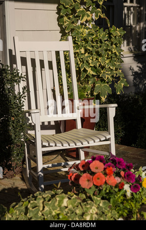 Rocking Chair and Flowers on Front Porch, NC, USA Stock Photo