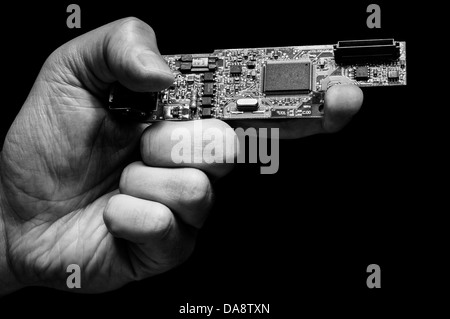 Hand holding a digital weapon Stock Photo