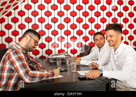 Business men having conversation at meeting in a modern room Stock Photo