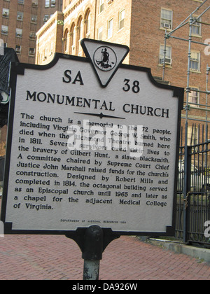 MONUMENTAL CHURCH This church is a memorial to the 72 people, including Virginia Governor George W. Smith, who died when the Richmond Theatre burned here in 1811. Several survivors owed their lives to the bravery of Gilbert Hunt, a slave blacksmith. A committee chaired by Supreme Court Chief Justice John Marshall raised funds for the church's construction. Designed by Robert Mills and completed in 1814, the octagonal building served as an Episcopal church until 1965 and later as a chapel for the adjacent Medical College of Virginia. Department of Historic Resources, 1992. Stock Photo