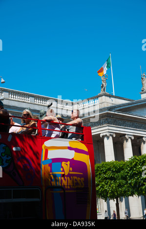 Tourist sightseeing tour bus in front of the General Post Office along O'Connell street central Dublin Ireland Europe Stock Photo