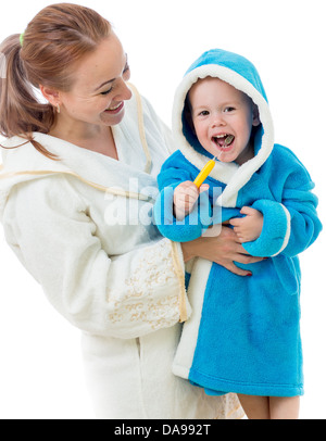 Happy mother and child teeth brushing together in bathroom Stock Photo