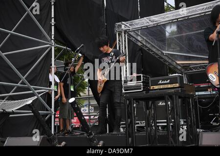 Mayday took a concert in storm in Huabo,Taiwan,Chian on Sunday July 07,2013. Stock Photo