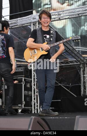 Mayday took a concert in storm in Huabo,Taiwan,Chian on Sunday July 07,2013. Stock Photo