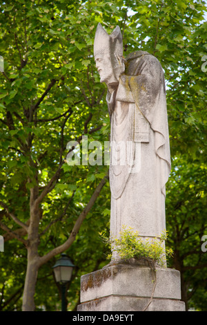 Statue of Saint Denis holding his own head after being beheaded for his Christian faith, Montmartre, Paris, France Stock Photo