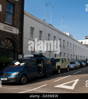 The media from across the world with satellite vans mark their spots near St. Mary's Hospital, Paddington, London, England, UK on 8th July 2013 in anticipation of the birth of the Royal baby. The first child of the Duke and Duchess of Cambridge, Prince George of Cambridge (George Alexander Louis) was born on 22 July and made his first public appearance at the Lindo Wing doors. Stock Photo