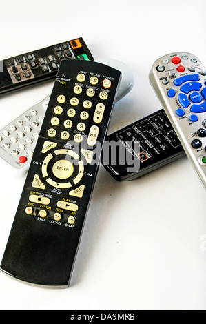 Various remote controls for television, satalitte reciever, stereo, sound system and vcr-dvd player. Stock Photo