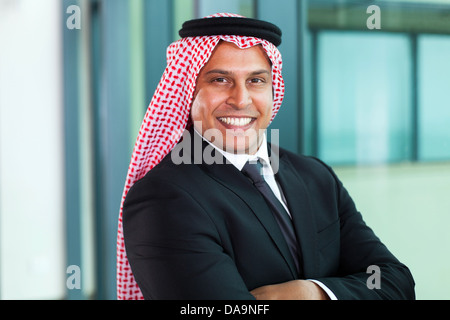 smiling middle eastern businessman in office Stock Photo