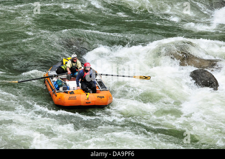 Tom and Alek rafting through the rapids at C Rock on the Wild and Scenic Rogue River in southern Oregon. Stock Photo