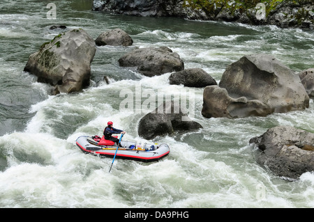 Alek rafting through the rapids at C Rock on the Wild and Scenic Rogue River in southern Oregon. Stock Photo