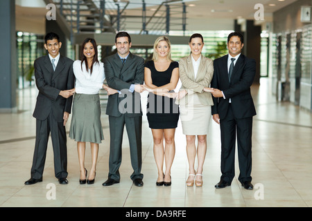 cheerful group of business people holding hands Stock Photo