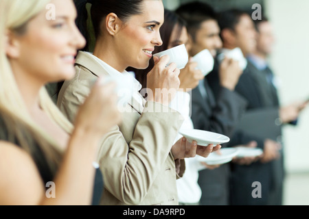 group of businesspeople having coffee during conference coffee break Stock Photo