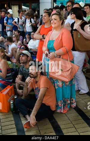 Spectators watching Wimbledon tennis on outdoor live TV screening in Wimbledon Town Centre London England  2013 2010s HOMER SYKES Stock Photo