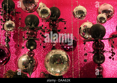 It's a photo of many different disco ball or mirror balls that are against a shiny sparkling pin background, Xmas decoration Stock Photo