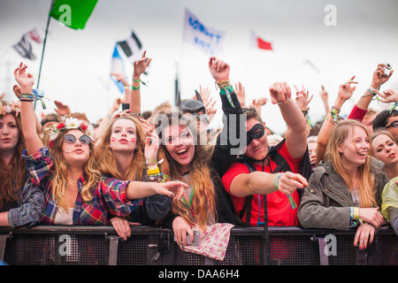 Fans cheer as Dizzee Rascal performs on the Pyramid Stage on the Friday of Glastonbury Festival. 28 June 2013 Stock Photo