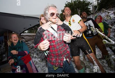 Festival goers take part in a snowball fight in the Greenpeace Village on the Friday of Glastonbury Festival. 28 June 2013 Stock Photo