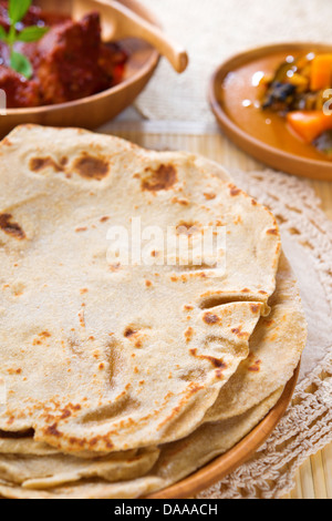 Chapati or Flat bread, Indian food, made from wheat flour dough. Chapatti, Dhal and curry. Stock Photo