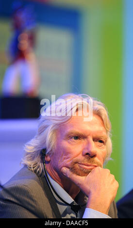 British enterpriser and billionaire Richard Branson is awarded with the German Media Prize 2010 at the Congress Center of Baden Baden, Germany, 24 January 2011. Despite his cruciate ligament rupture, he showed up on crutches to receive his prize. Since 1992, the German Media Prize is awarded to a public figure, who has, according to the view of the chief editors in the selection co Stock Photo
