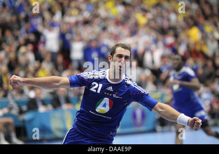 Michael Guigou of France celebrates after scoring during the Men's Handball World Championship semi-final match France against Sweden in Malmo, Sweden, 28 January 2011. France won the match with 29-26 and moves up to finals. Photo: Jens Wolf Stock Photo