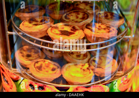 Famous Portuguese egg tarts, or 'Pastel de nata', for sale in Food Street, old Taipa village. Stock Photo