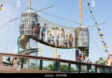 Children play on the pirate ship in the kids' field on the Friday of Glastonbury Festival. Stock Photo