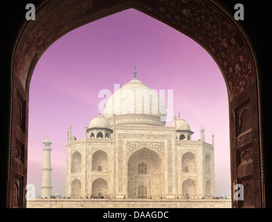 Taj Mahal through arch, Indian Symbol - India travel background. Agra, Uttar Pradesh, India Stock Photo