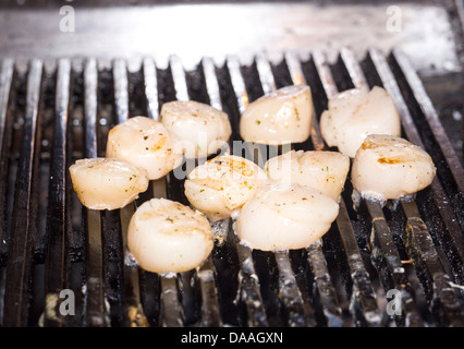 cooking scallops on the grill Stock Photo
