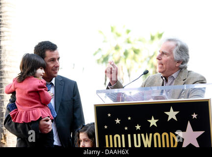 Actor Henry Winkler (r) speaks during a ceremony honoring actor Adam Sandler, pictured with his daughters Sunny (red top) and Sadie, with a star on the Hollywood Walk of Fame in Los Angeles, USA, on 01 february 2011. Photo: Hubert B Stock Photo