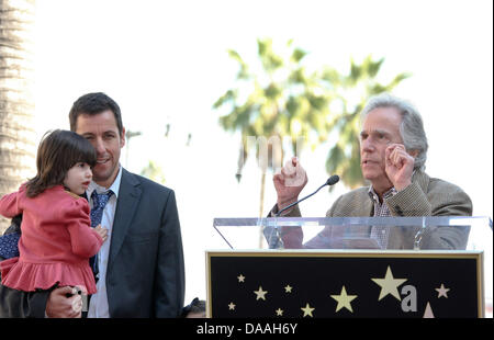 Actor Henry Winkler (r) speaks during a ceremony honoring actor Adam Sandler, pictured with his daughter Sunny, with a star on the Hollywood Walk of Fame in Los Angeles, USA, on 01 february 2011. Photo: Hubert B Stock Photo