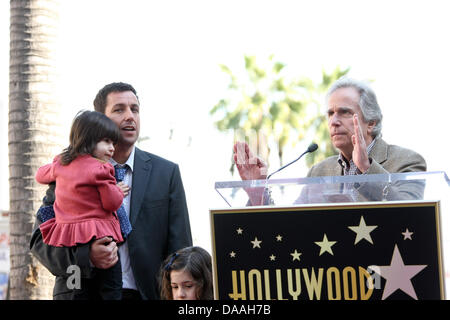 Actor Henry Winkler (r) speaks during a ceremony honoring actor Adam Sandler, pictured with his daughters Sunny (red top) and Sadie, with a star on the Hollywood Walk of Fame in Los Angeles, USA, on 01 february 2011. Photo: Hubert B Stock Photo