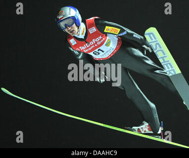 The Polish ski jumper Adam Malysz achieved a  distance of 137,5 meters at the ski jumping world championships in Klingenthal, Germany, 01 February 2011. Photo: Hendrik Schmidt Stock Photo