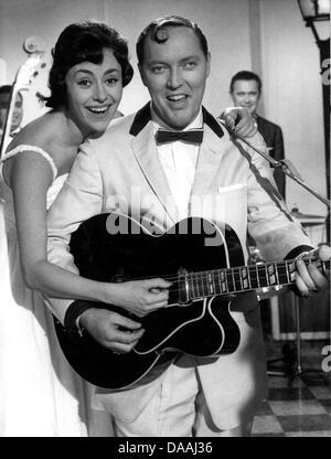 (file) - A dpa file picture dated 30 November 1957 shows US rock & roll musician Bill Haley and actress Caterina Valente on a film in Berlin, Germany. Haley died of heart failure on 09 February 2011 at the age of 55. Photo: dpa Stock Photo