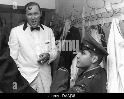 (file) - A dpa file picture dated 23 October 1958 shows US rock & roll musicians Elvis Presley (R) and Bill Haley in a dressing room before one of Haley's shows in Frankfurt am Main, Germany. Haley died of heart failure on 09 February 2011 at the age of 55. Photo: dpa Stock Photo