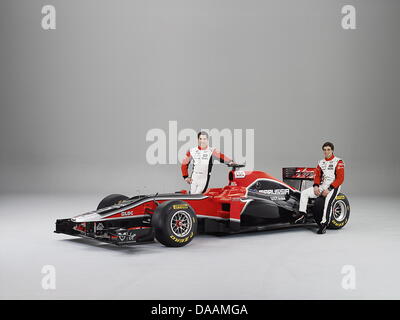 An undated Marussia Virgin Racing handout picture shows German Formula One driver Timo Glock (L) and Belgian colleague Jerome D'Ambrosio with the new MVR-02 Formula One racing car of the Marussia Virgin Racing team. The MVR-02 was unveiled at the BBC's Television Centre in London on 07 February 2011. Photo: MARUSSIA VIRGIN RACING - HANDOUT EDITORIAL USE ONLY/NO SALES Stock Photo