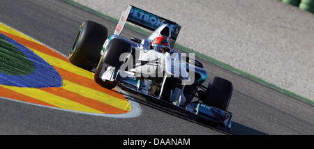 German Formula One driver Michael Schumacher drives his car during a test round on the racetrack in Valencia, Spain, 1 February 2011. Photo: Jens Buettner Stock Photo