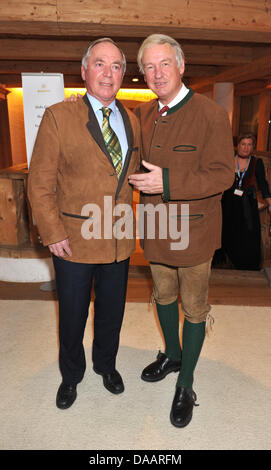 Former Austrian ski athlete Karl Schranz (l) and innkeeper Balthasar Hauser poses during the 20th Bavarian Veal Sausage Party Going, Austria, 22 January 2011. The 2500 guests warmed up for the following Hahnenkamm Race in Kitzbuehl. Photo: Felix Hoerhager Stock Photo