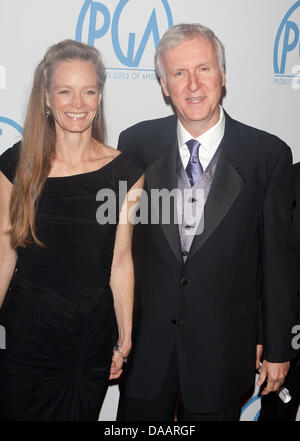 US director James Cameron and his wife, actress Suzy Amis Cameron, arrive for the 22nd Annual Producer's Guild Awards at Hotel Beverly Hilton in Beverly Hills, Los Angeles, USA, on 22 January 2011. Photo: Hubert Boesl Stock Photo