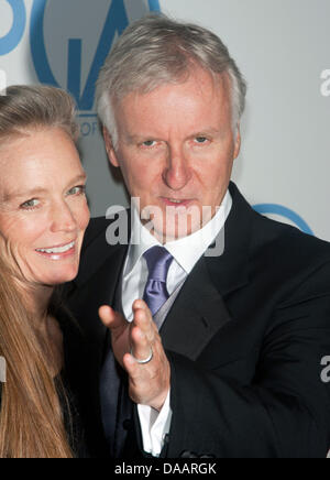 US director James Cameron and his wife, actress Suzy Amis Cameron, arrive for the 22nd Annual Producer's Guild Awards at Hotel Beverly Hilton in Beverly Hills, Los Angeles, USA, on 22 January 2011. Photo: Hubert Boesl Stock Photo