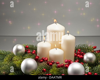 Advent wreath with burning candles for the pre Christmas time Stock Photo