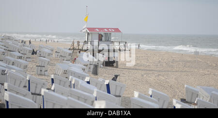 Many empty beach chairs sit on the beach on the North Sea island of Sylt in Westerland, Germany, 24 September 2011. Photo: ANGELIKA WARMUTH Stock Photo